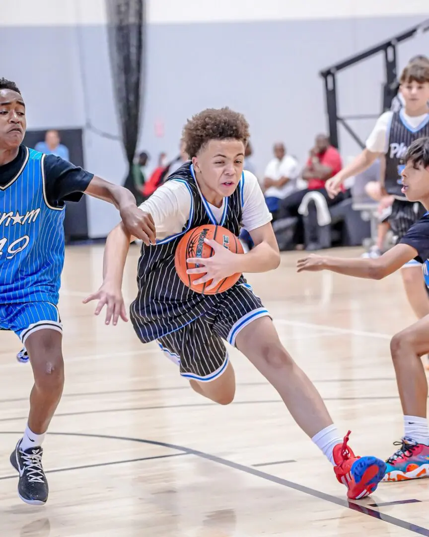 Youth basketball player dribbling ball.