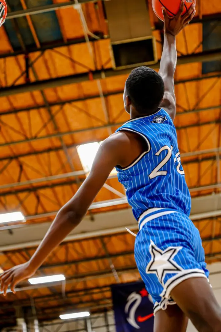 Basketball player shooting hoops.