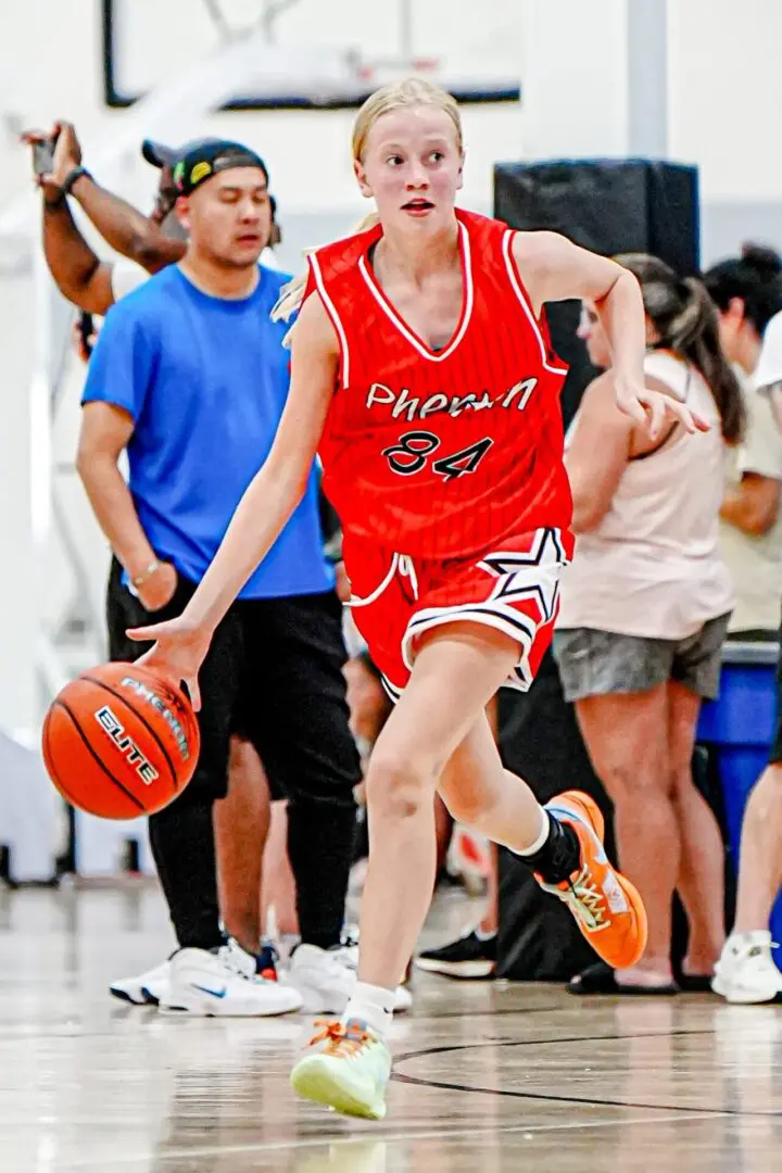 Girl dribbling basketball, Phenom 84.