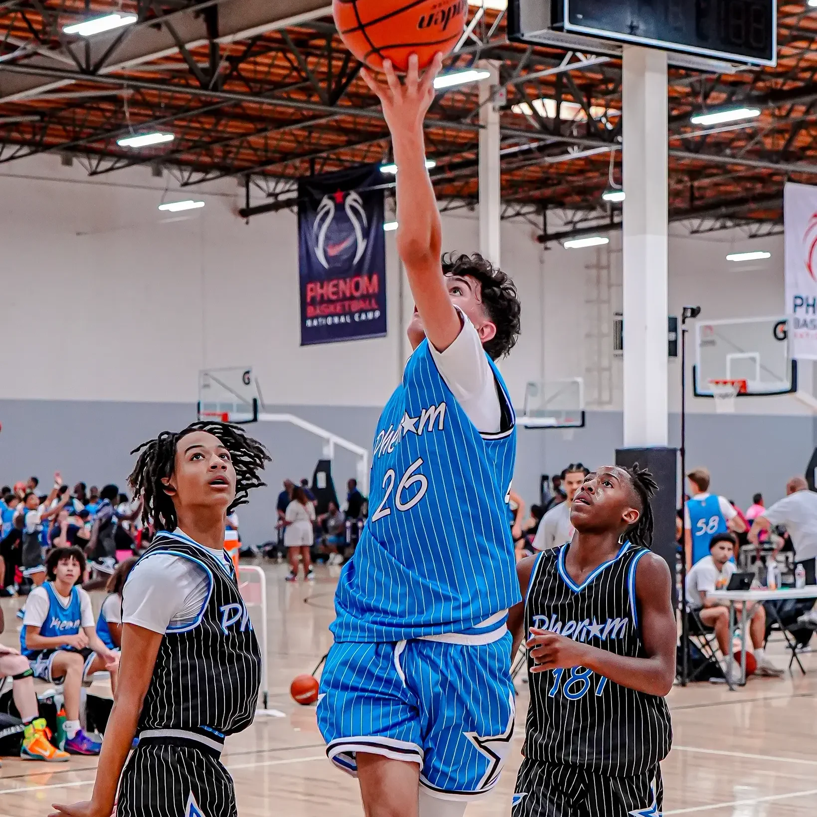 Basketball player shooting during a game.